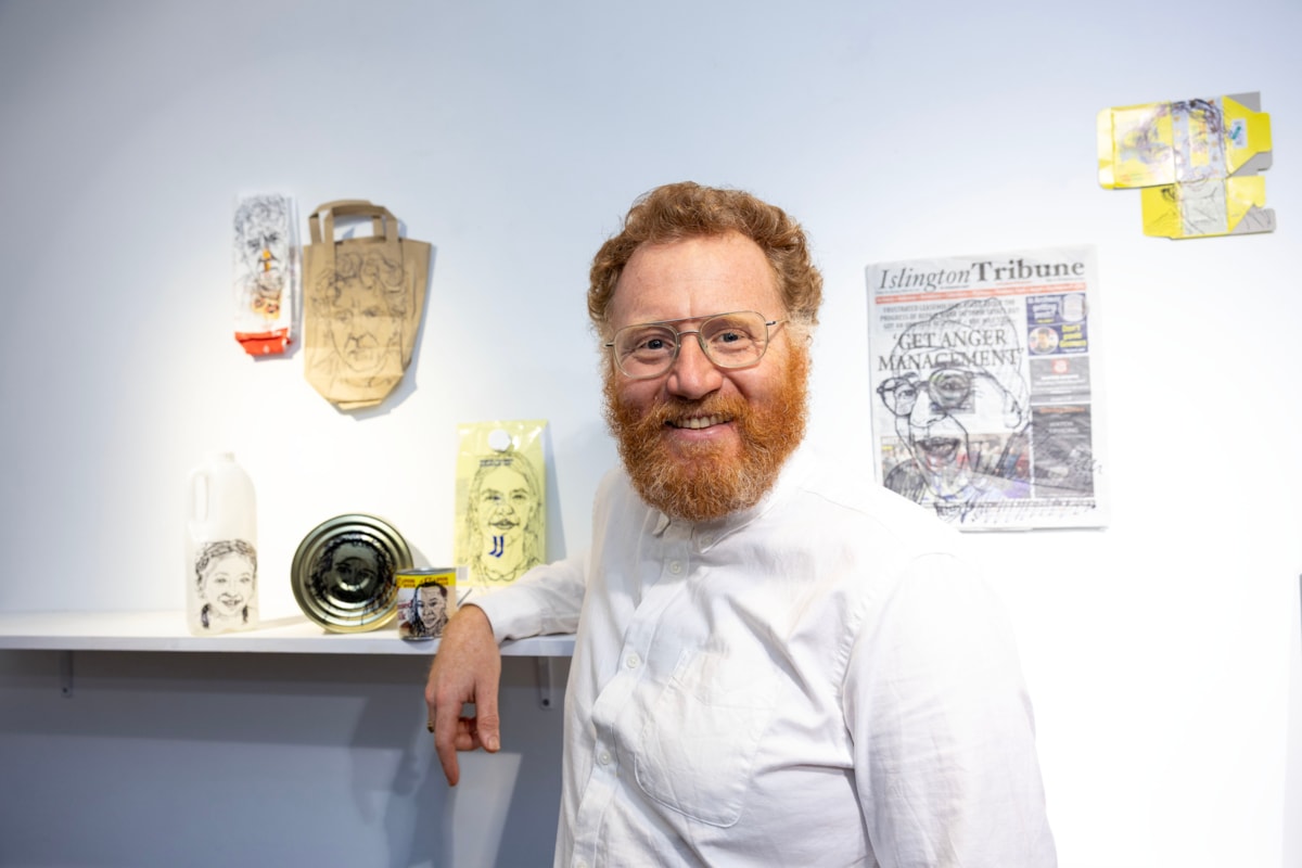 Freddie Yauner with his artworks