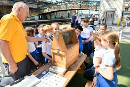 Robin MacLeod, Chairman of Carlisle Beekeepers Association, tells pupils from Robert Ferguson Primary School how bees move around using an observational beehive