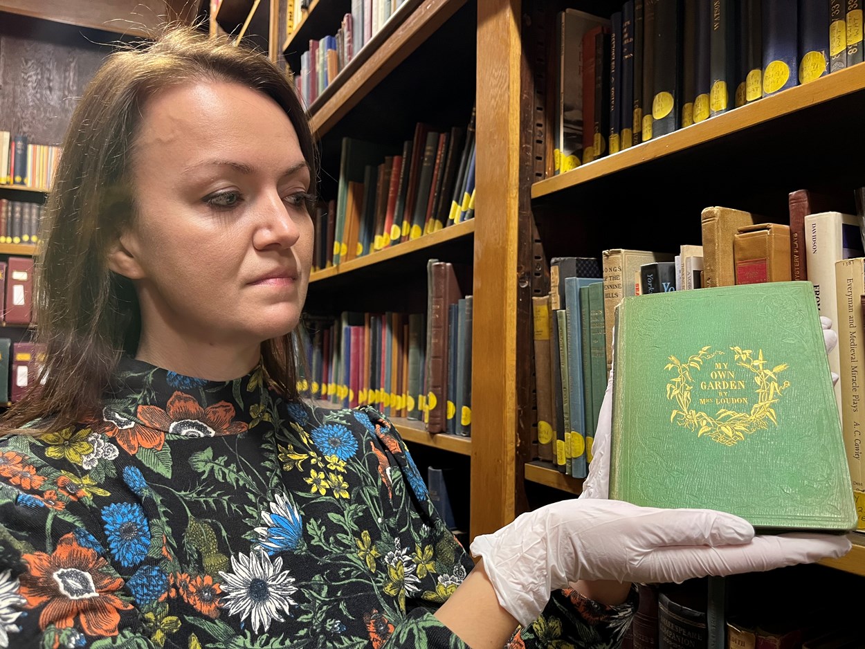 Leeds Central Library's poisonous book: Rhian Isaac, Leeds Central Library's senior librarian with the library's copy of My Own Garden: The Young Gardener’s Yearbook. Published back in 1855, it has been safely tucked away behind the scenes at Leeds Central Library, well away from visitors.
Recent research carried out by experts at the library revealed that the seemingly unassuming book most likely owes its vivid, emerald, green colour to a dye containing quantities of arsenic, which can be lethal when ingested.