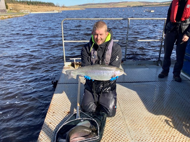 Llyn Brenig Fish Farmer Jack Finney stocking lake March 2022 2