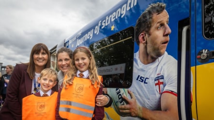 Lindsey Burrow, two of her children Maya and Jackson, and Northern's managing director Tricia Williams with the Rob Burrow train