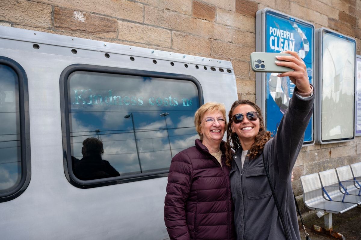 Members of the public interact with Hope in Hamilton art installation, which displays messages from local community to promote positive mental health