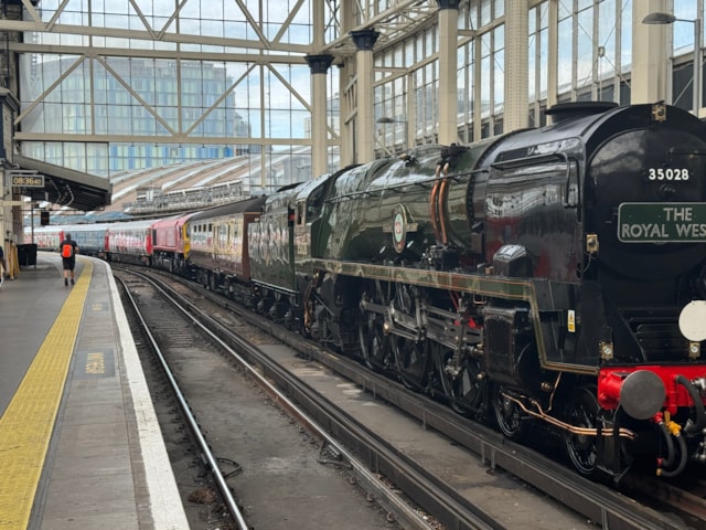 Clan Line locomotive ahead of the Exhibition Train at London Waterloo