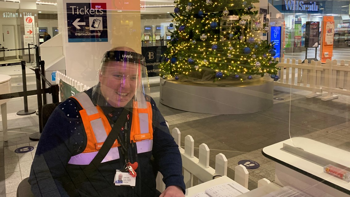 Dan Noon behind the customer services desk at Birmingham New Street Christmas 2020
