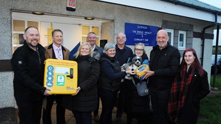 Gatehead community hub defib handover from MJD scaffolding.