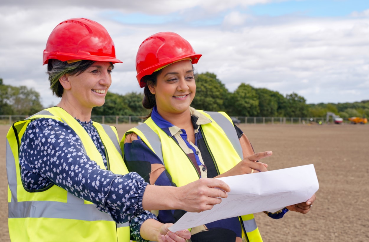 Whinmoor 1: Councillor Helen Hayden (Leeds City Council’s executive member for children and families) and Councillor Salma Arif (Leeds City Council’s executive member for adult social care, active lifestyles and culture) at the Whinmoor Grange site where two new football pitches are taking shape.