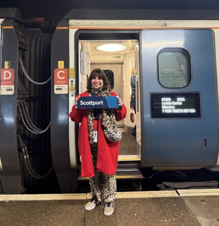 Lisa Magee, Station Manager at Stockport station, sends the 'Scottport' sign down to London.