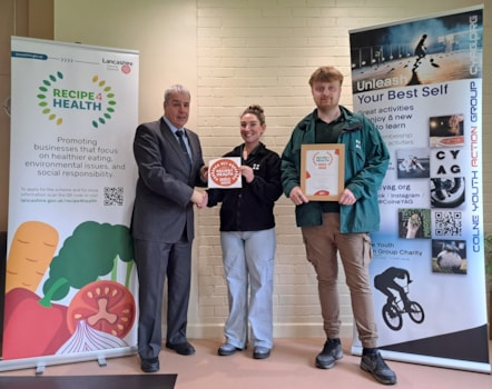 Colne Youth Action Group volunteers Stacey Faulkner and Bradley Croke accept the Award from Jamal Dermott, Recipe 4 Health lead at Lancashire County Council