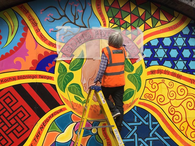 The finishing touches to the new mural at Smethwick Rolfe Street station