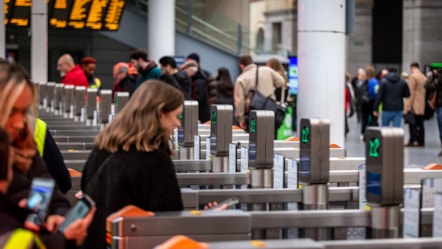 Customers walking through a gateline at Manchester Victoria station cropped