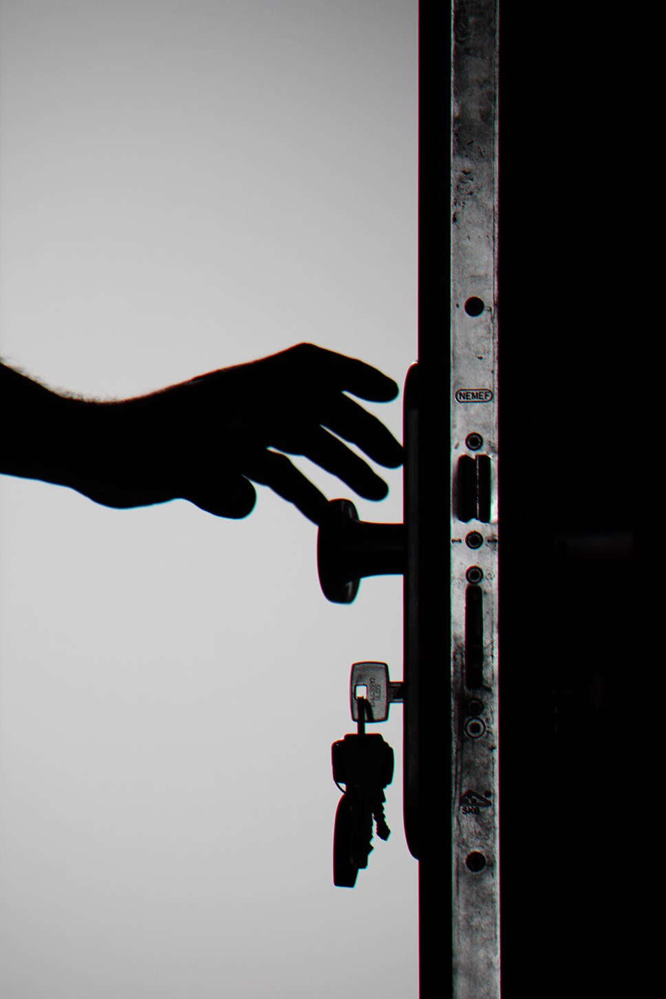 silhouette-photo-of-person-holding-door-knob-792032-3