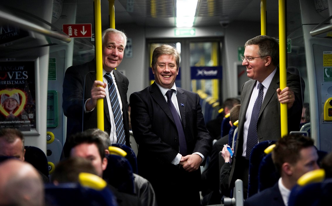 Paisley Canal 2: ScotRail MD Steve Montgomery, left, Transport Minister Keith Brown, centre, and Network Rail Scotland route managing director David Simpson join morning commuters on the first day of the newly electrified Paisley Canal service
