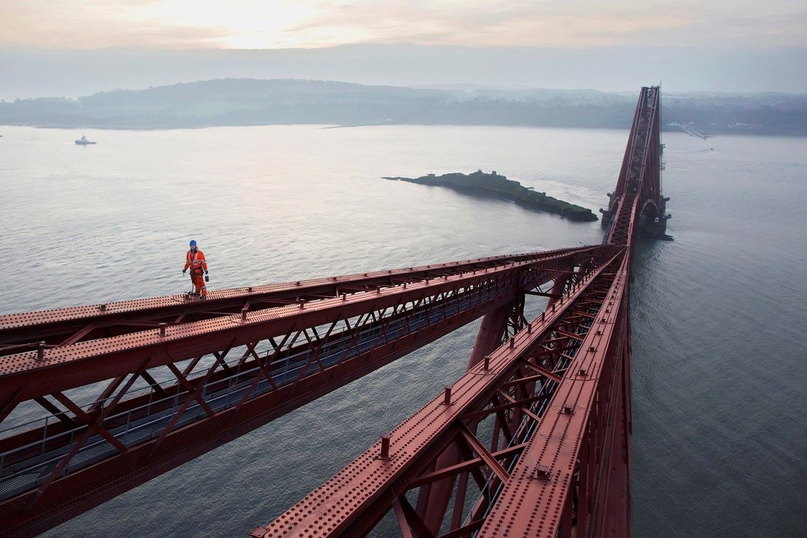 Forth Bridge December 2011: Pic019: Abseiler, William Waddall, 32, negotiates the top member of the Fife Tower, echoing the footsteps of many brave men who have gone before him.