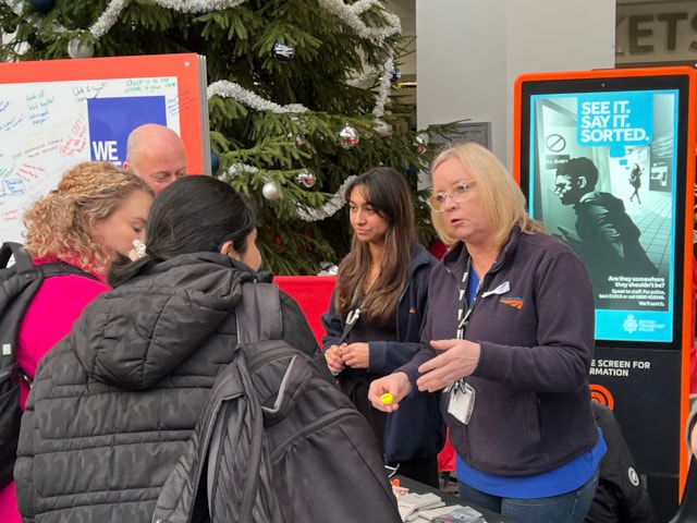 Passengers at Birmingham New Street learning more about the White Ribbon campaign: Passengers at Birmingham New Street learning more about the White Ribbon campaign