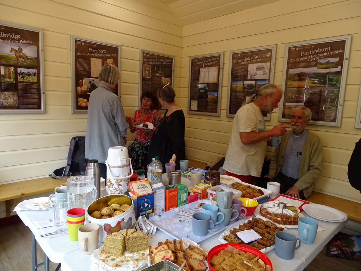 This image shows community members enjoying the new exhibition at Haltwhistle station