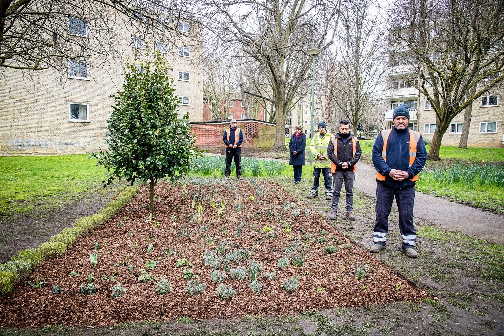 Staff from Islington's Greenspace and Housing teams with a camellia bush planted to mark the one-year anniversary of the first coronavirus lockdown