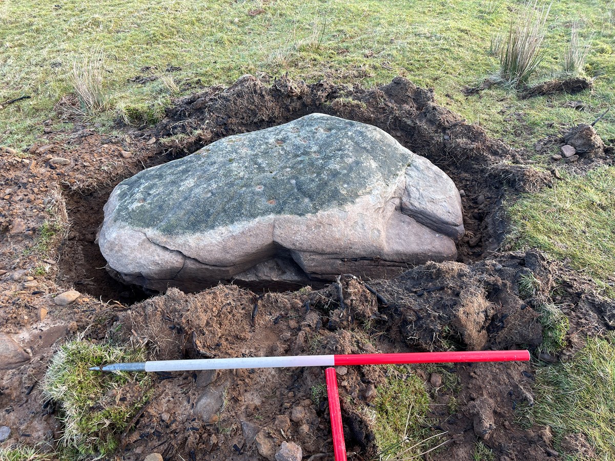 Cadw - GM628 - 2023-01-16 - JH  - 03 - Close up of the western side of the stone showing unauthorised excavation