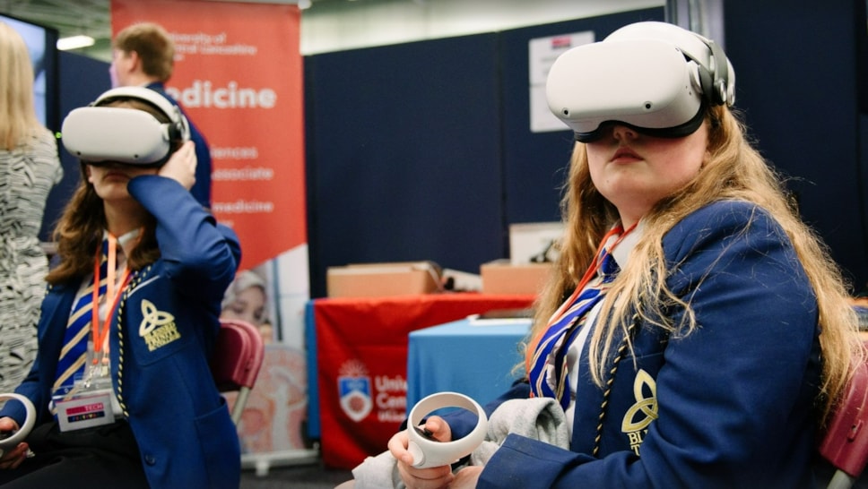 Students use virtual reality to experience a clinical interactive demo at the 2024 TeenTech Lancashire Festival.