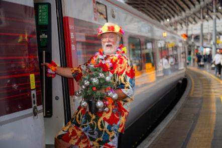 'Summer Santa' boarding LNER Azuma train