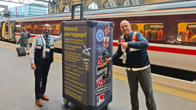 Giant suitcase raising awareness of bag thefts at King’s Cross: LtoR Shift station manager Arfaan Pinjara and station customer experience manager Toby Meadows