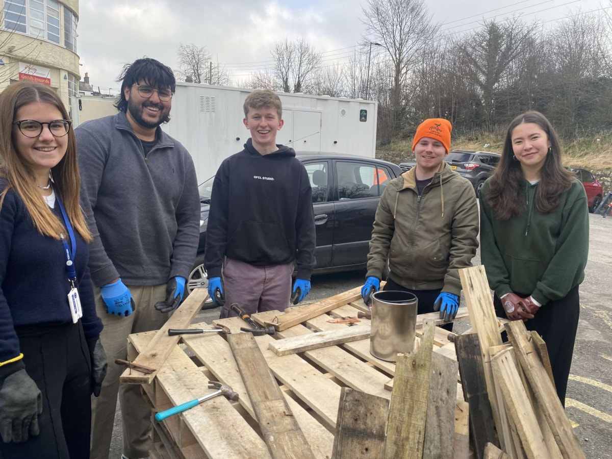 Image shows Year in Industry students creating'Bug Hotels' - 1