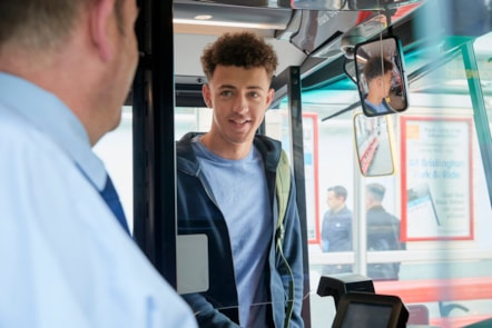 Young customer boarding a First bus