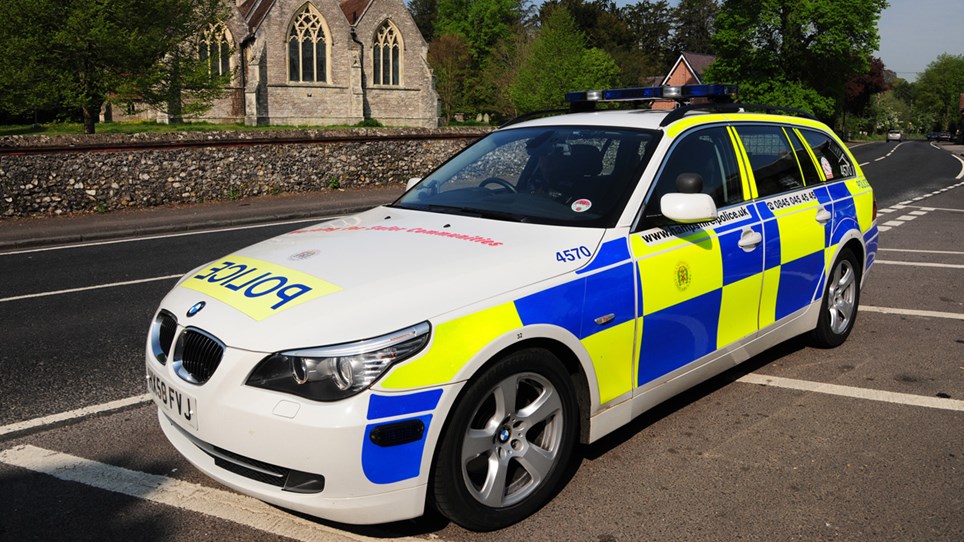 Police car rural setting - Hero Image