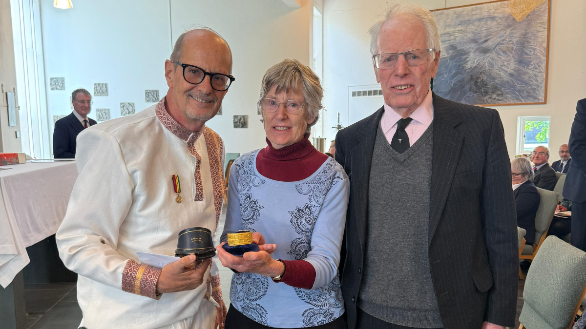 Hero image - Lord Robert Napier (R) with his sister, Ruth Self, and Dr Alula Pankhurst with the bracelet