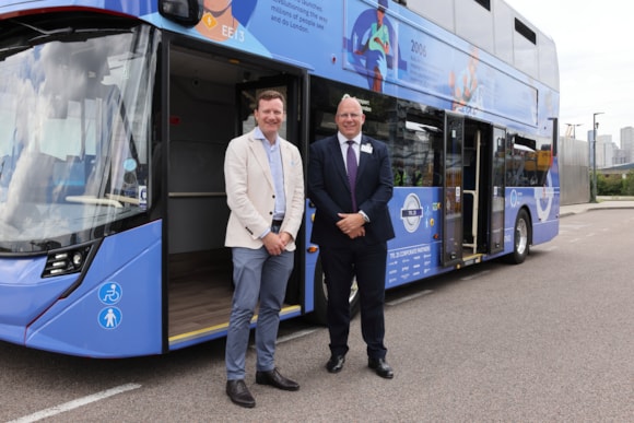 TfL Image - TfL Commissioner Andy Lord and Deputy Mayor Seb Dance with TfL25 wrapped bus