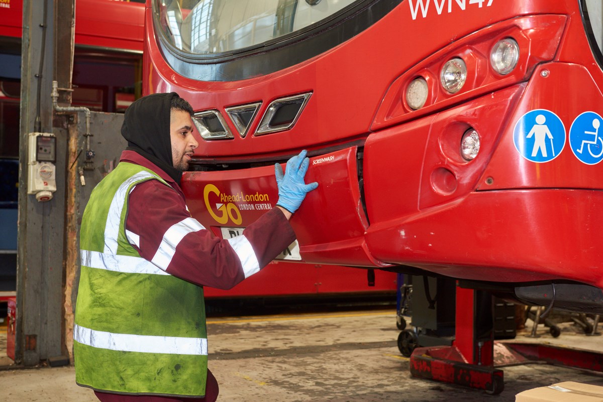 A service engineer, Bruno Antonio, at Go-Ahead Group's Bexleyheath depot checks a bus.