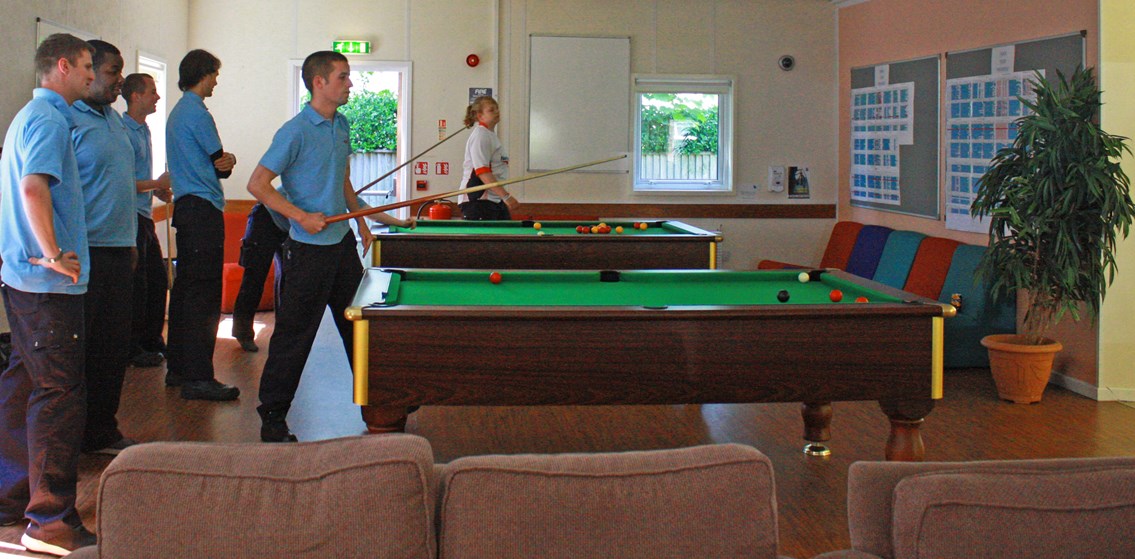 Network Rail apprentice playing pool in the break out area: Network Rail apprentice playing pool in the break out area