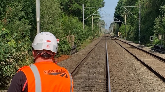 Passengers warned of delays after overhead lines damaged on the West Coast main line: Engineer at the site in Bramhall