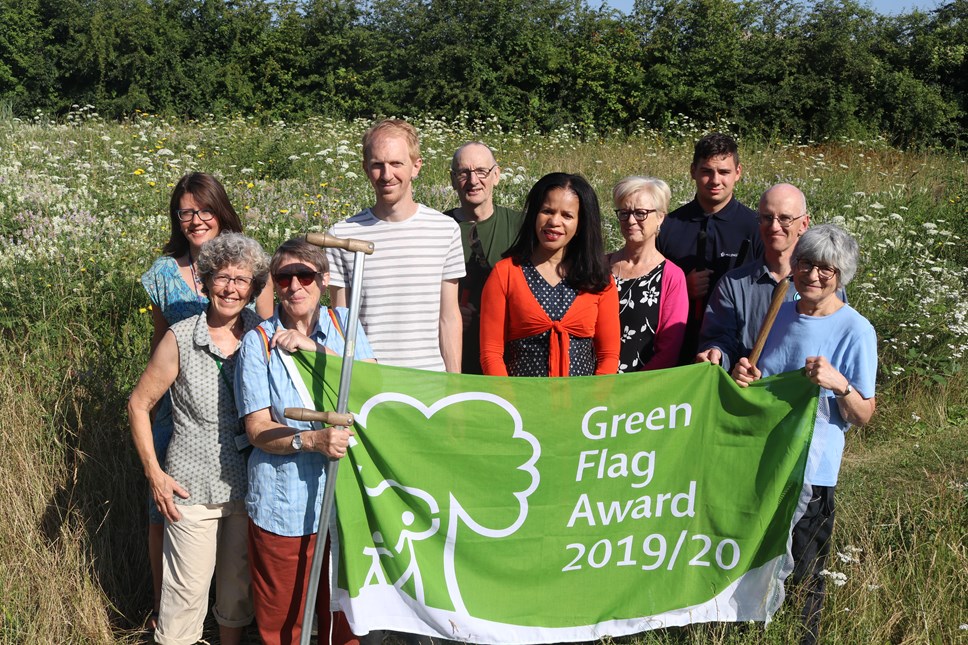 Cllr Claudia Webbe, centre, and Friends of Gillespie Park chair Sue Jandy (fourth from right), celebrate the Green Flag Award with staff and other members of the Friends group.