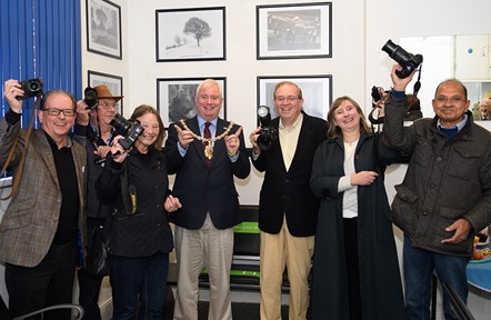 Cheltenham Borough Council Mayor, Councillor Steve Harvey, with members of Cheltenham Camera Club at the launch of their exhibition at Cheltenham Spa station.