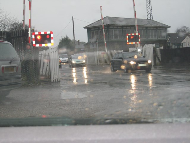 Motorist caught driving through warning lights. Farncombe West level crossing, Surrey: Motorist caught driving through warning lights. Farncombe West level crossing, Surrey