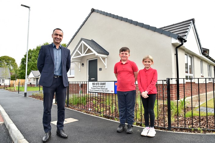 Housing: Councillor Mohammed Rafique at a new Leeds City Council housing development in Seacroft, with Parklands Primary School pupils Harrison Hirst and Rihanna Kaye.