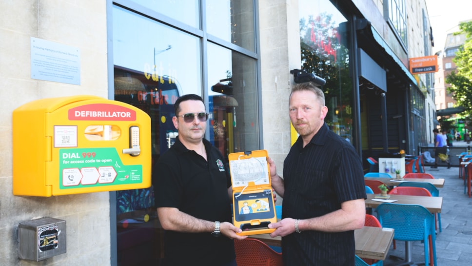 First Bus driver Carlos Santos (left) and Richard Dewdney with the defibrillator @JonCraig Photos