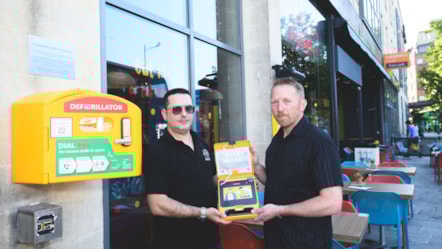 First Bus driver Carlos Santos (left) and Richard Dewdney with the defibrillator @JonCraig Photos