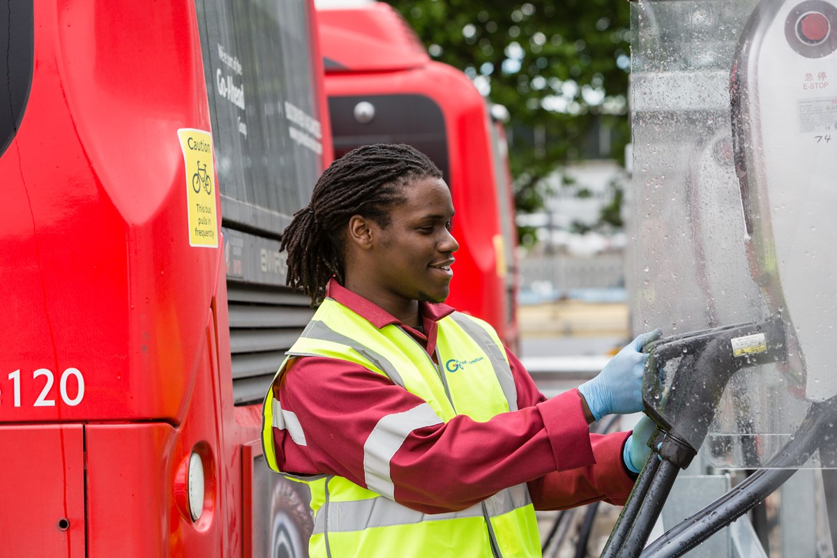Damani Roberts Franklin a Service Centre Manager plugs in an electric bus at Northumberland Park depot London
