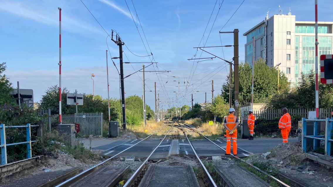 Level crossing revamp means changes to London Overground and Southern services for four days in October: Mitre Bridge level crossing with staff on site