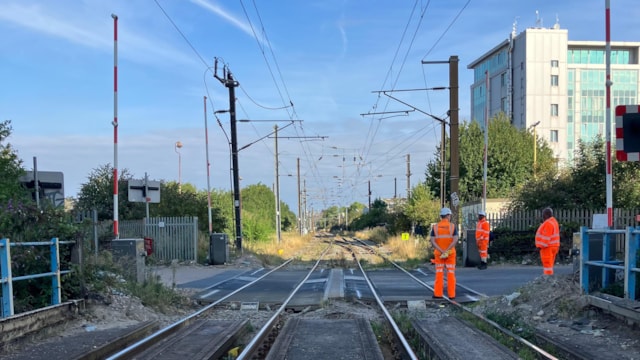 Level crossing revamp means changes to London Overground and Southern services for four days in October: Mitre Bridge level crossing with staff on site