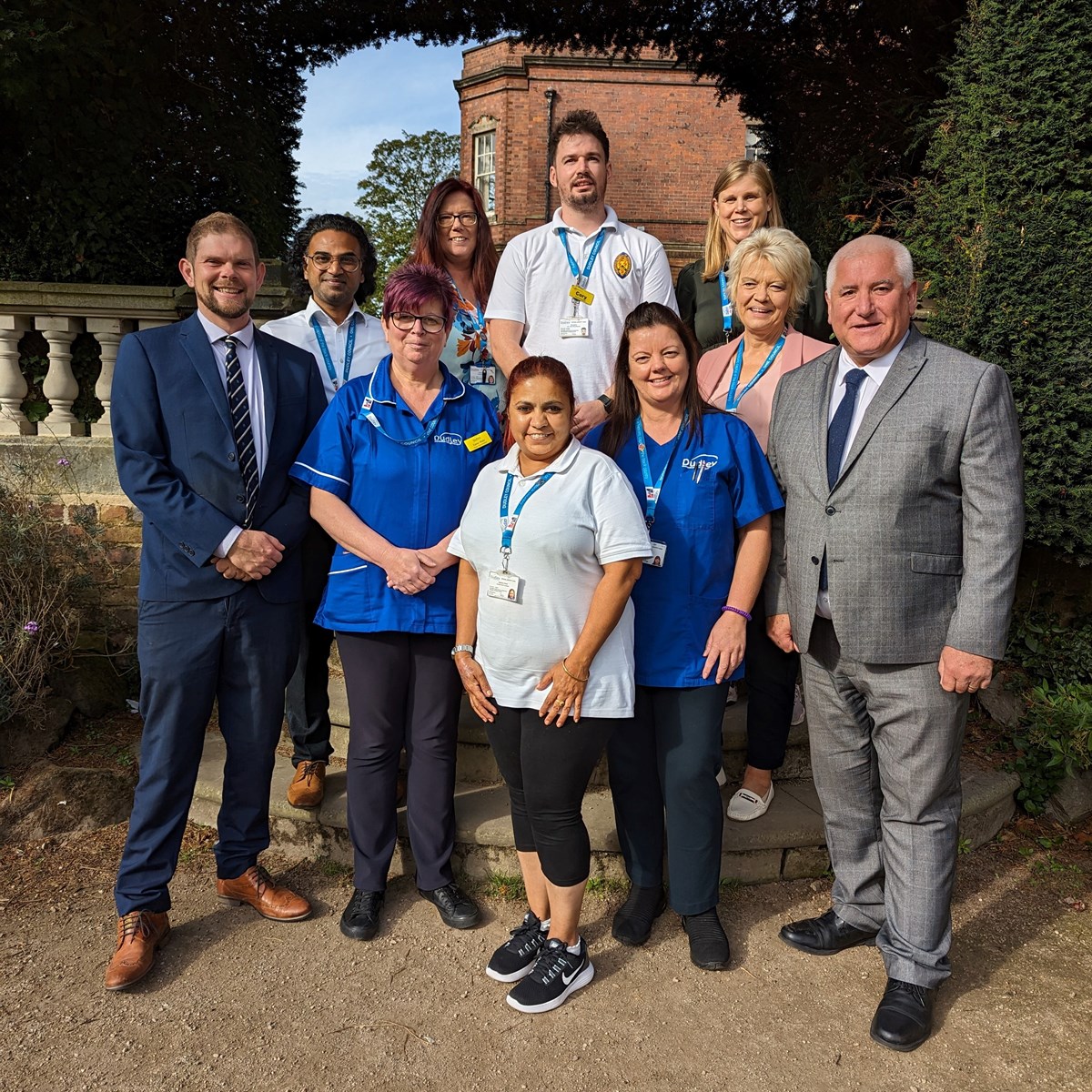 Cllr Matt Rogers (left) and Cllr Patrick Harley with members of the new reablement team SQUARE