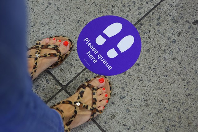 TfL Image - Station floor sign Please wait here