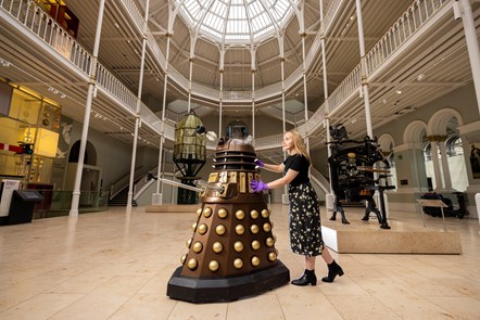 Liv Mullen wheels a Dalek into the National Museum of Scotland ahead of major exhibition. Photo credit © Duncan McGlynn (3)