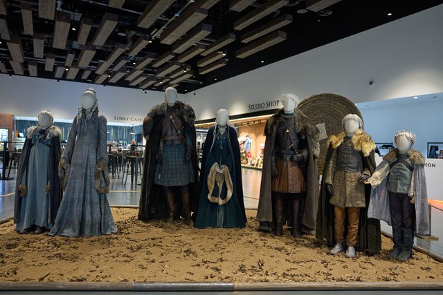 Winter is Coming: A Stark Family Reunion costume display at Game of Thrones Studio Tour: Winter is Coming: A Stark Family Reunion display at Game of Thrones Studio Tour celebrates the first costumes worn by the much-loved Winterfell clan this autumn. When winter comes, the first costume worn by Jon Snow will join the Starks.
The display is now on show at the official Game of Thrones Studio Tour in Northern Ireland.

Left to right: Arya Stark, Sansa Stark, Ned Stark, Catelyn Stark, Robb Stark, Bran Stark, Rickon Stark