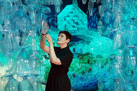 Curator Dr Ali Clark with the Bottled Ocean 2123 installation by George Nuku, part of a new exhibition, Rising Tide: Art and Environment in Oceania which opens Saturday 12 August at the National Museum of Scotland (credit Stewart Attwood)