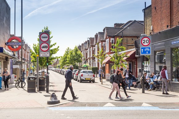 TfL Press Release - New data shows significant improvements in road safety in London since introduction of 20mph speed limits: TfL Image - Pedestrians cross the road outside Tooting Bec station