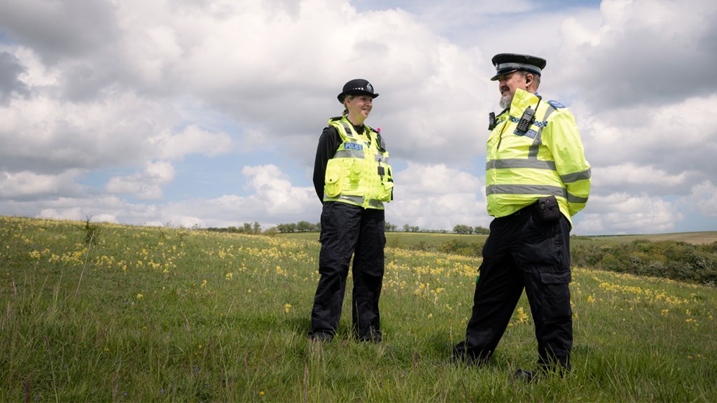 Two officers in a field - Hero Image