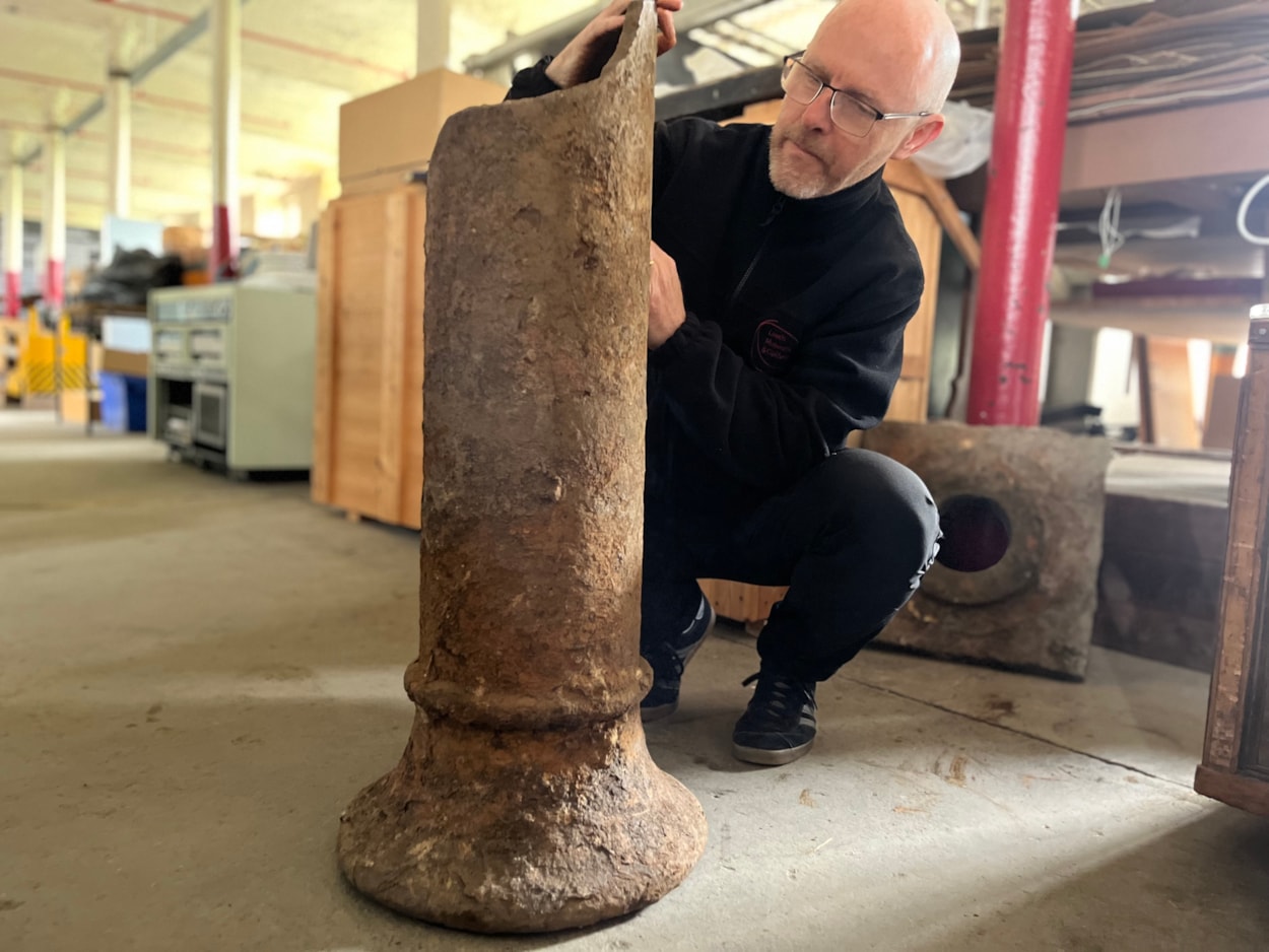 Train station excavation: John McGoldrick, Leeds Museums and Galleries’ curator of industrial history with the remnants of one of the station’s huge cast iron pillars, which would once have held up the roof while passengers made their way around its platforms. The impressive iron columns also doubled as rainwater down pipes.