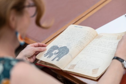 Member of the public looks at Jackie Kay's 'Wildlife' notebook - Credit Aly Wight